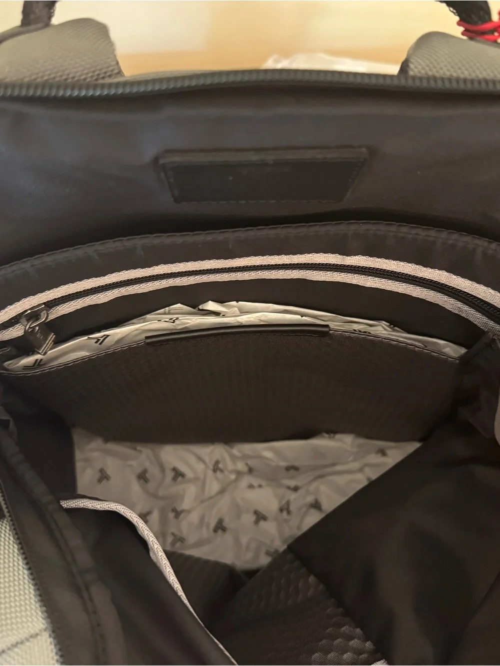 Tumi Gray Parrish Backpack with Black Trim and Tan Leather Tag